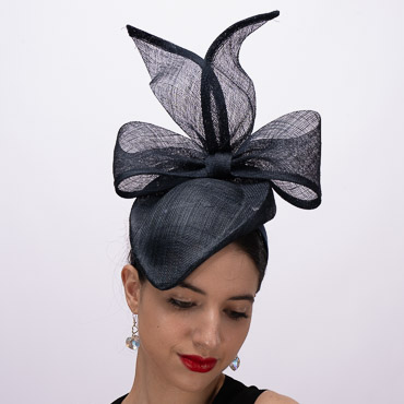 Big Bow In The Back Of The Sinamay Pillbox Fascinator Adding Height